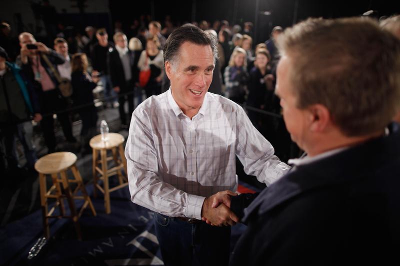 Republican presidential candidate, former Massachusetts Governor Mitt Romney greets supporters during a campaign town hall meeting at the Boys and Girls Club January 5, 2012 in Salem, New Hampshire.